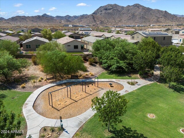 birds eye view of property featuring a mountain view