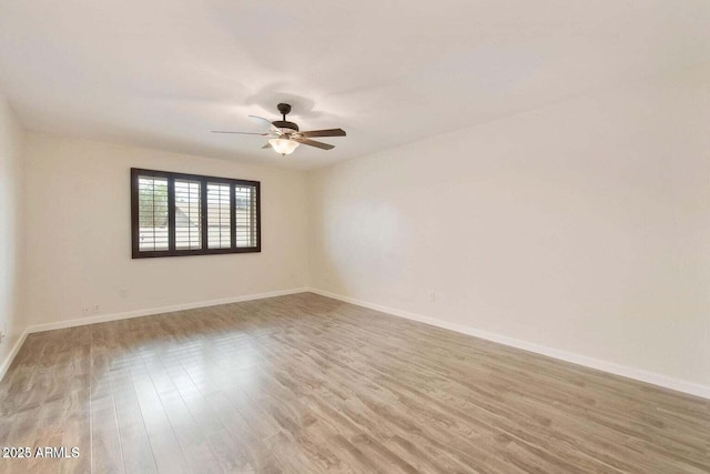 unfurnished room with ceiling fan and light hardwood / wood-style flooring