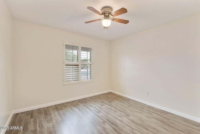 unfurnished room featuring ceiling fan and light hardwood / wood-style floors