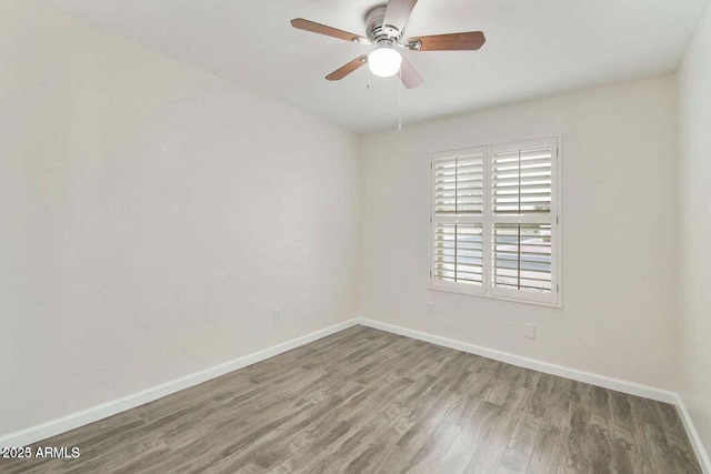 empty room with ceiling fan and wood-type flooring