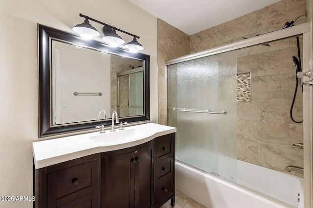 bathroom with vanity and bath / shower combo with glass door