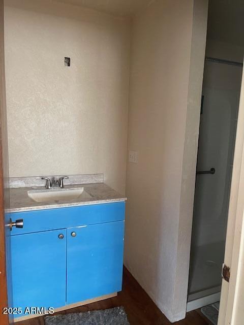 1010 N Florida Ave, Douglas, AZ 85607 - bathroom featuring vanity and wood finished floors
