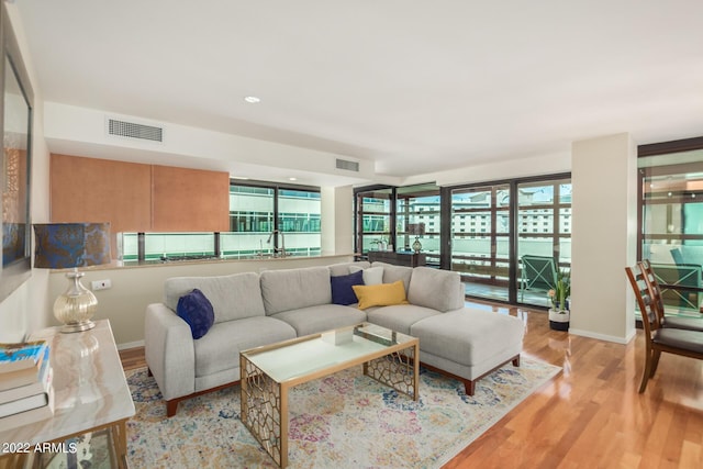 living room with light hardwood / wood-style flooring