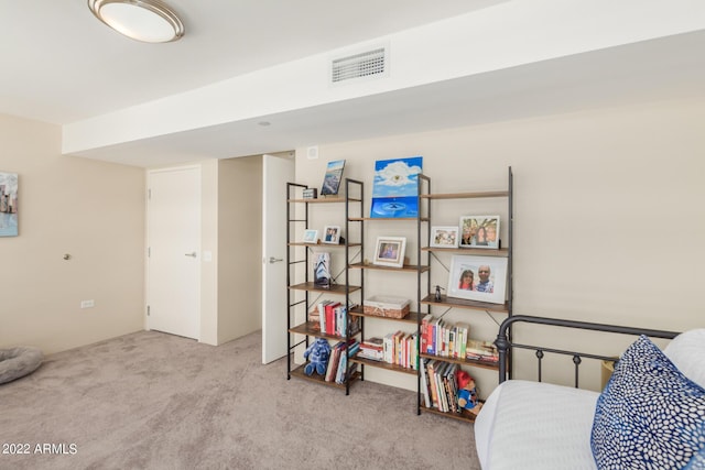 bedroom with light colored carpet