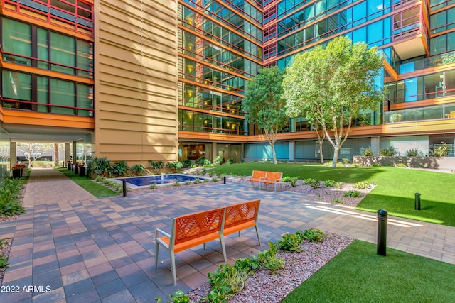 surrounding community featuring a yard and a patio