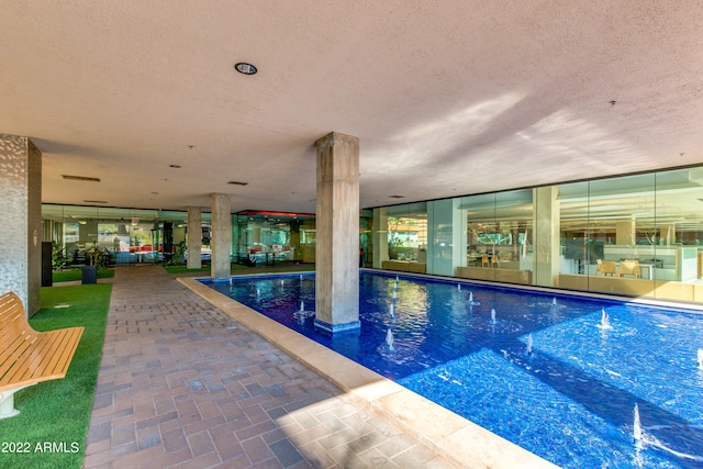 view of pool featuring a jacuzzi