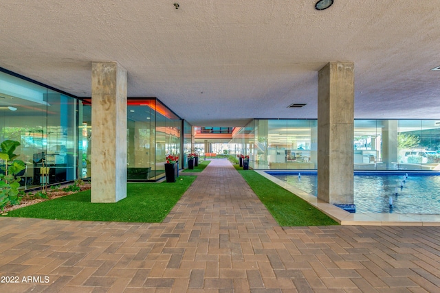 exterior space featuring a swimming pool