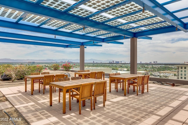 view of patio featuring a mountain view and a pergola