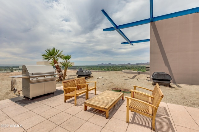 view of patio featuring a grill