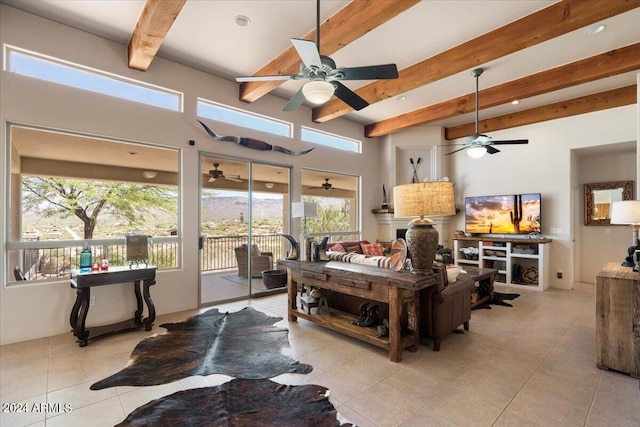 living room with ceiling fan, light tile patterned floors, and beam ceiling