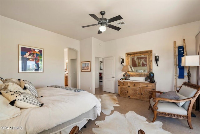 bedroom featuring light tile patterned floors and ceiling fan