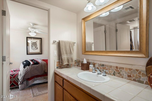 bathroom featuring vanity, tile patterned flooring, and ceiling fan