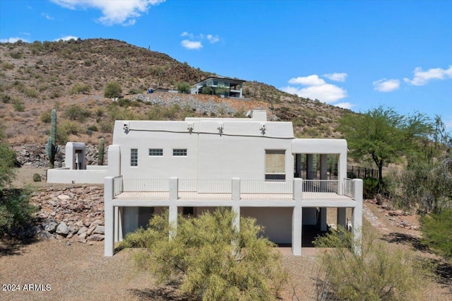 back of house featuring a mountain view