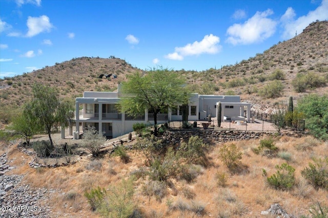 back of house featuring a mountain view