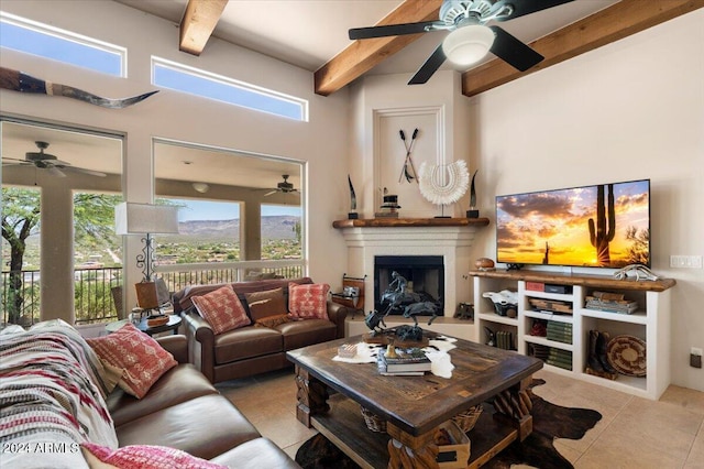 living room featuring beamed ceiling and light tile patterned flooring