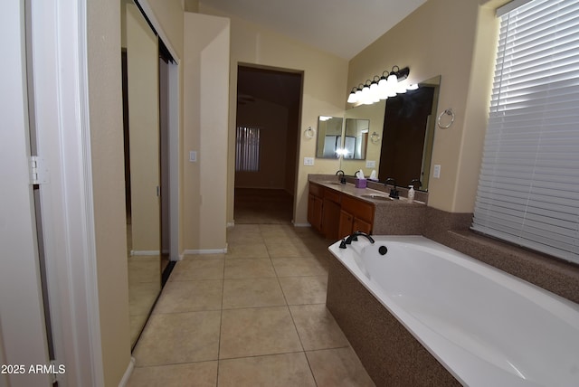 9145 W Menadota Dr, Peoria, AZ 85382 - full bath featuring tile patterned flooring, double vanity, a sink, and a washtub