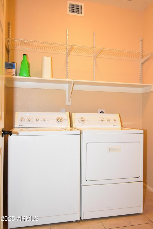 9145 W Menadota Dr, Peoria, AZ 85382 - laundry area featuring visible vents, independent washer and dryer, laundry area, and light tile patterned floors