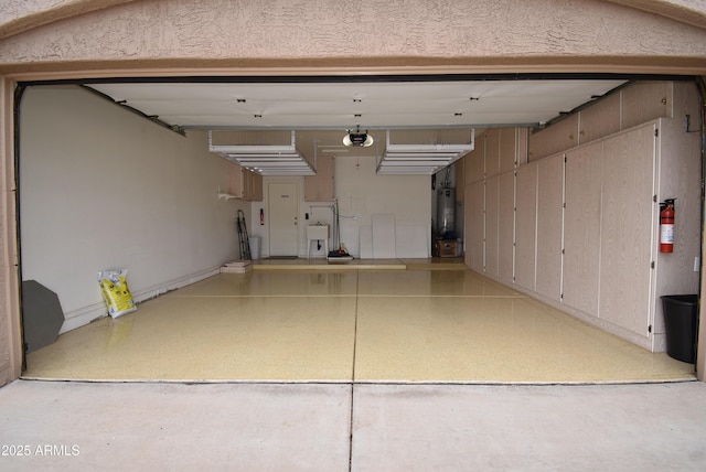 9145 W Menadota Dr, Peoria, AZ 85382 - garage with gas water heater and a garage door opener