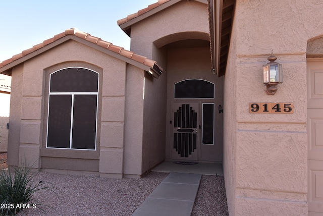 9145 W Menadota Dr, Peoria, AZ 85382 - entrance to property featuring a tiled roof and stucco siding