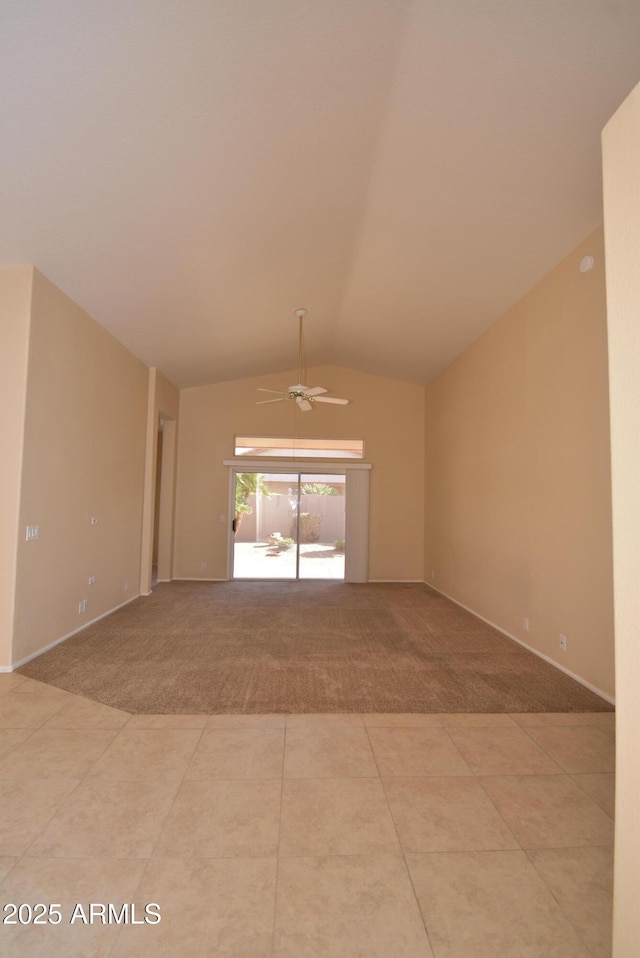9145 W Menadota Dr, Peoria, AZ 85382 - empty room featuring baseboards, light colored carpet, vaulted ceiling, and ceiling fan