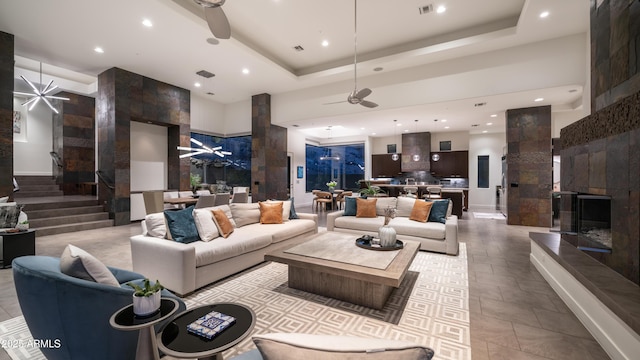1805 E Rocky Slope Dr, Phoenix, AZ 85048 - living area featuring recessed lighting, a fireplace, a raised ceiling, and a ceiling fan