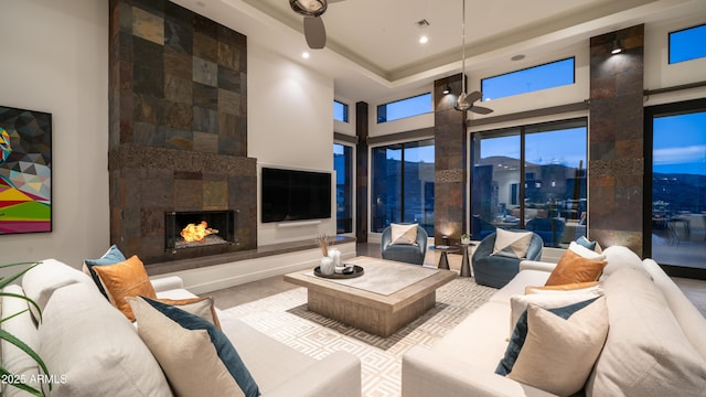 1805 E Rocky Slope Dr, Phoenix, AZ 85048 - tiled living room featuring visible vents, recessed lighting, a high ceiling, a premium fireplace, and ceiling fan