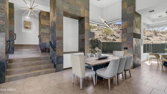 1805 E Rocky Slope Dr, Phoenix, AZ 85048 - dining room featuring tile patterned flooring, visible vents, stairs, and a high ceiling