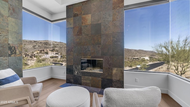 1805 E Rocky Slope Dr, Phoenix, AZ 85048 - interior space featuring a mountain view, a fireplace, baseboards, and wood finished floors