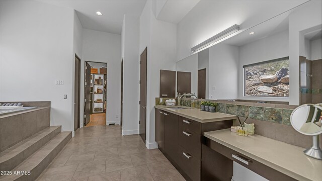 1805 E Rocky Slope Dr, Phoenix, AZ 85048 - full bathroom with tile patterned flooring, a relaxing tiled tub, recessed lighting, a towering ceiling, and vanity