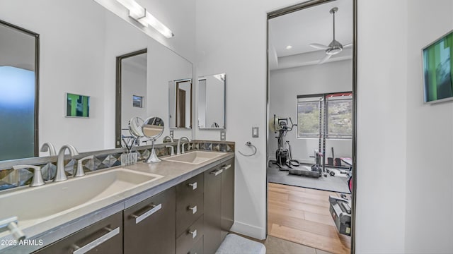 1805 E Rocky Slope Dr, Phoenix, AZ 85048 - bathroom with a sink, double vanity, wood finished floors, and a ceiling fan