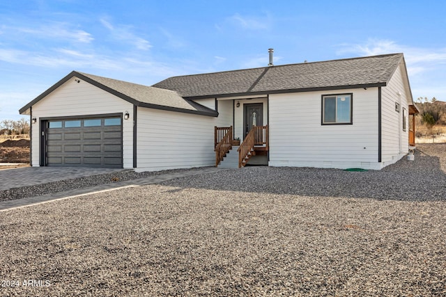 ranch-style house featuring a garage