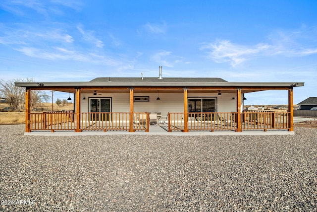 back of house with ceiling fan