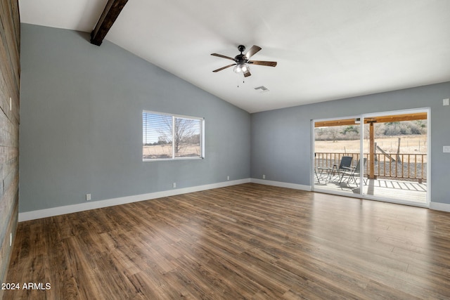 unfurnished room featuring ceiling fan, hardwood / wood-style floors, and lofted ceiling with beams