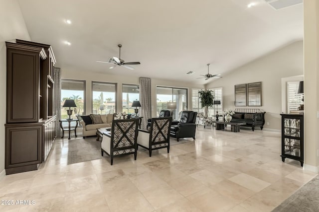 living room with ceiling fan and vaulted ceiling