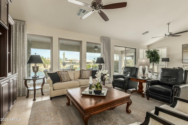 sunroom featuring vaulted ceiling and plenty of natural light