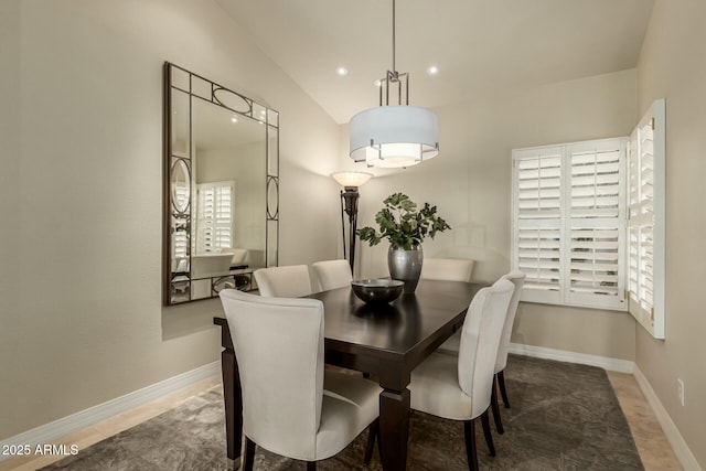 dining area featuring lofted ceiling