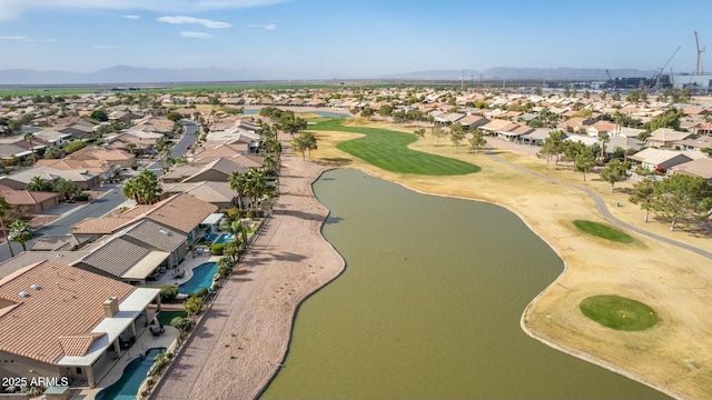 birds eye view of property with a water and mountain view