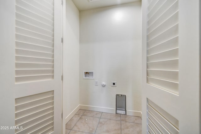 laundry area with hookup for a washing machine, light tile patterned flooring, and hookup for an electric dryer