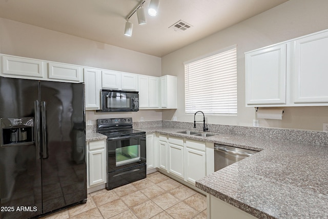 kitchen with sink, light tile patterned floors, black appliances, and white cabinets