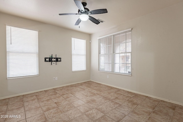 spare room with ceiling fan