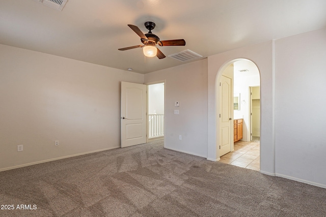 unfurnished room with light carpet and ceiling fan