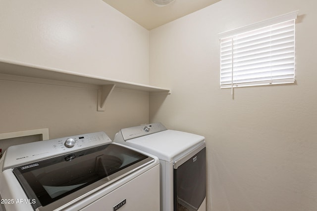 washroom with washer and dryer