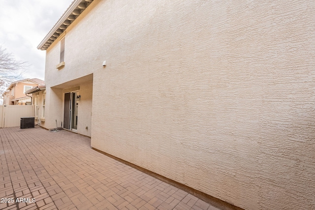 view of home's exterior featuring central AC and a patio area