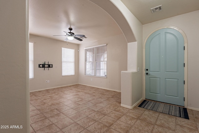 entrance foyer with ceiling fan