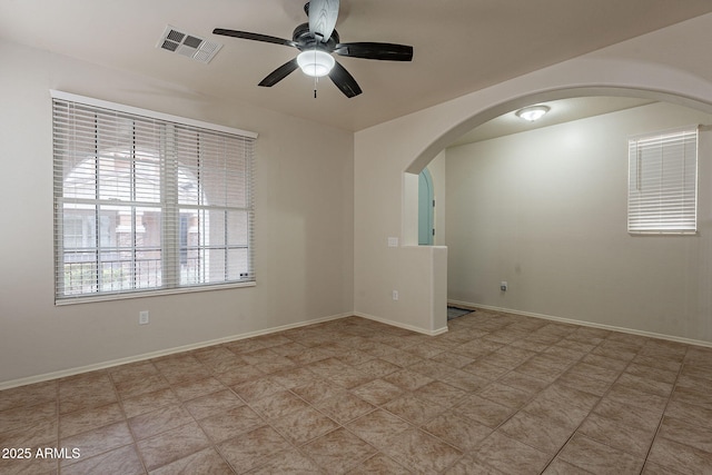 spare room with ceiling fan