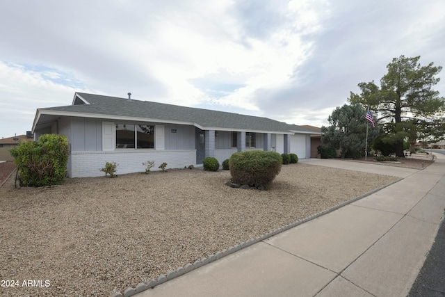 ranch-style house featuring a garage