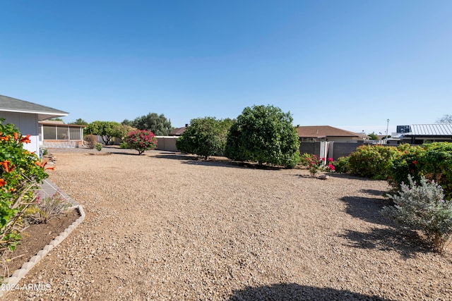 view of yard featuring a sunroom