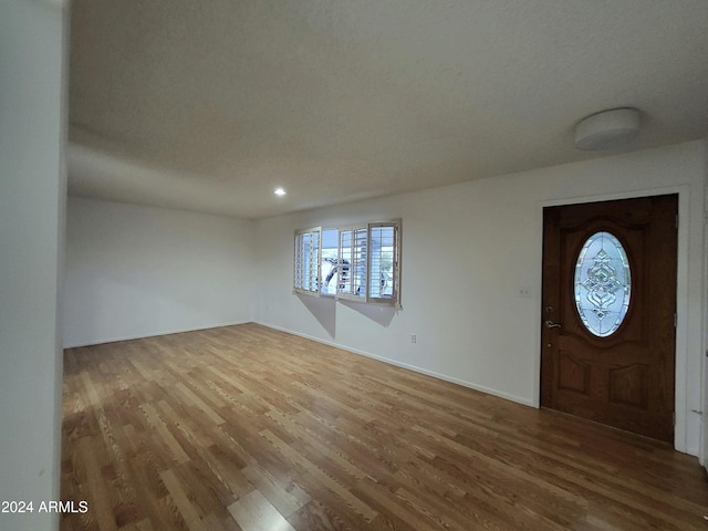 foyer with wood-type flooring