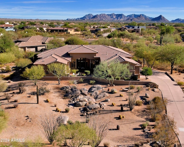 birds eye view of property with a mountain view