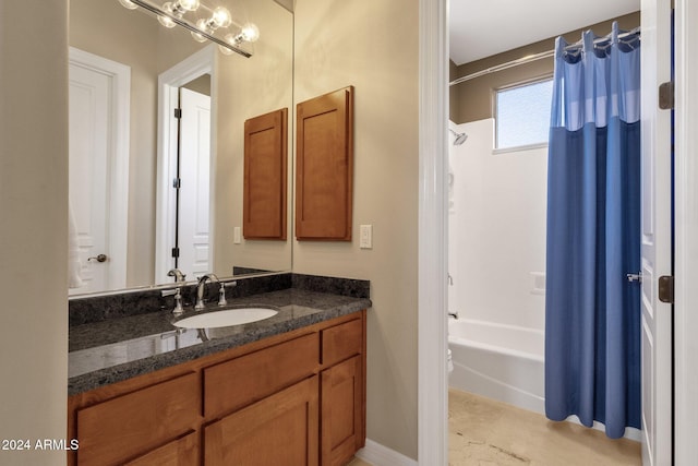 bathroom featuring vanity and shower / tub combo with curtain